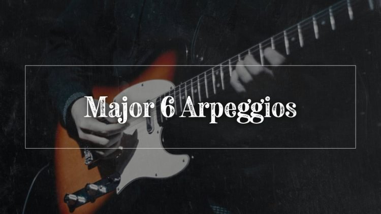 guy playing arpeggios on the guitar